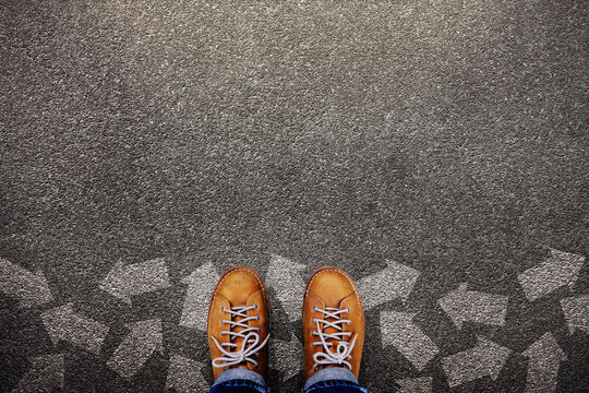 Standing among many Arrows, symbolizing Decision, Choice, Direction