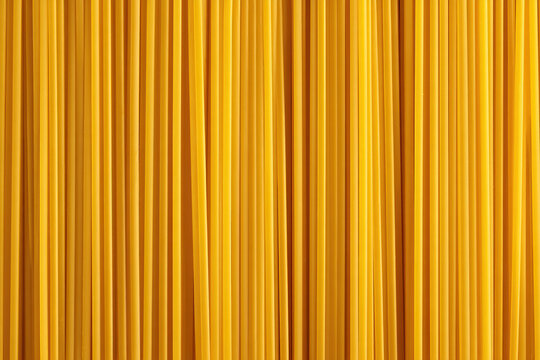 Close-up of uncooked spaghetti pasta background