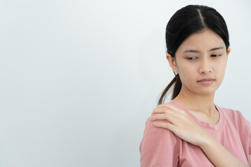 woman holding on shoulder and while and suffer from unbearable pain health and problems, chronic...
