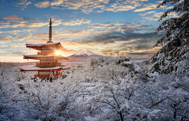 Fujiyoshida, Japan Beautiful view of mountain Fuji and Chureito pagoda at sunrise of Mount Fuji during winter.This is one of the famous spot to take pictures of Mount Fuji.