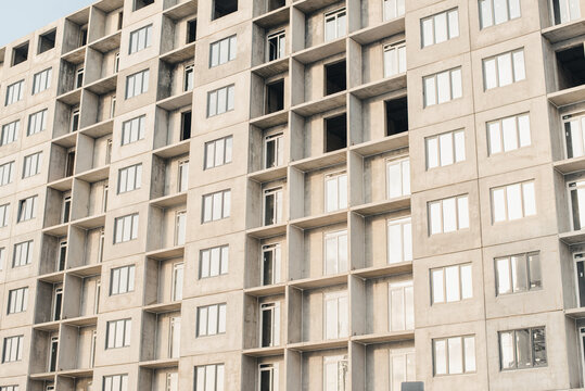 facade of a building. New building. House under construction. Construction site.