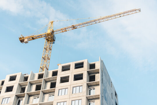 building under construction. New building. House under construction. Construction site. House under construction and a crane.
