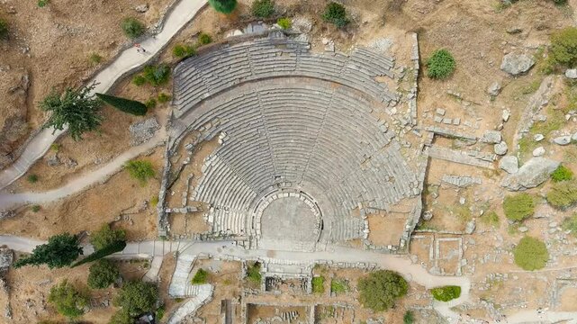 Delphi, Greece. Ruins of the ancient city of Delphi. Sunny weather, Summer. Drone footage, HEAD OVER SHOT