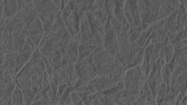Close up view of a crinkled textured grey paper surface background with interesting detail