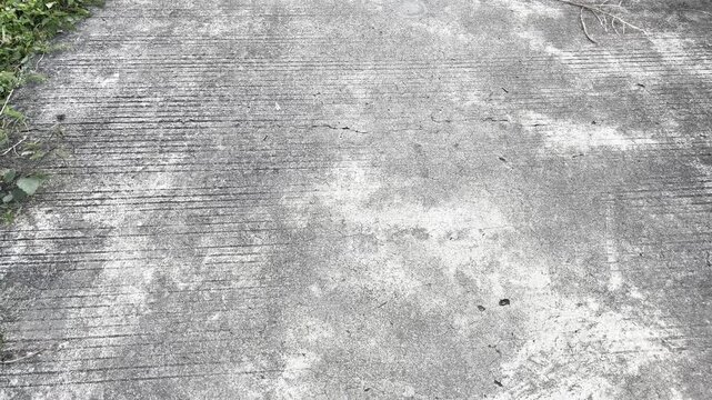 Rough concrete texture background with horizontal grooved patterns