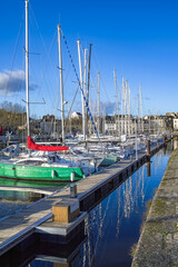 Fototapeta premium Vannes, beautiful city in Brittany, a traditional boat in the harbor, with typical houses 