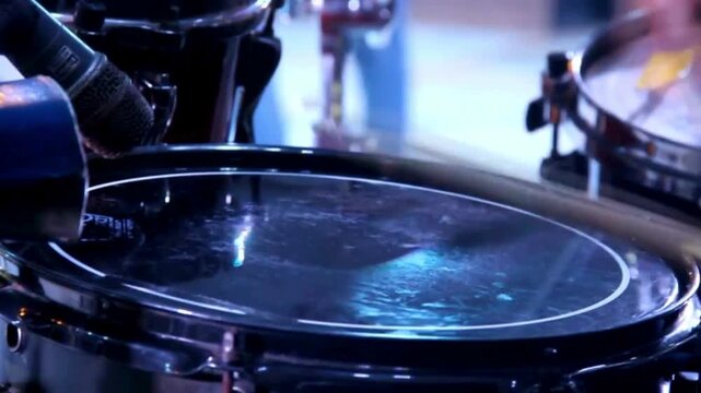 cymbal drumstick in slow motion Playing drums close-up A young Caucasian man drummer plays a drum kit in a music studio plays with sticks on 4K UHD