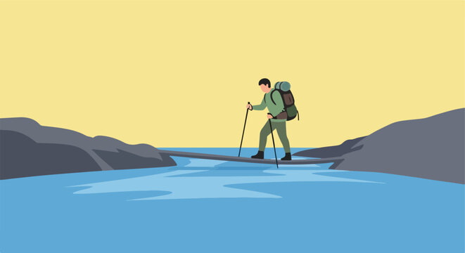 Hiker crosses a narrow log bridge over a blue river, yellow sky