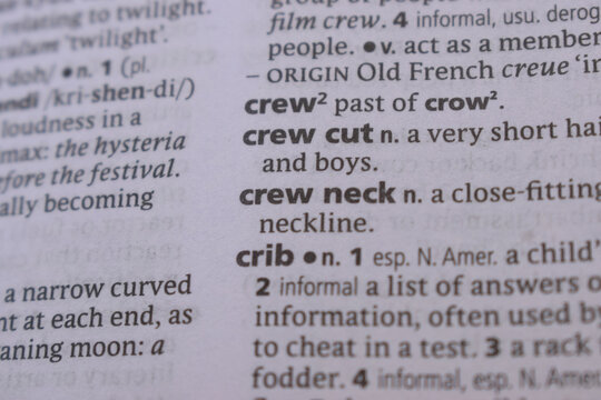 English Dictionary Book Page Close Up With The Word Transcription Of -crew cut