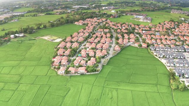 Residential land and houses in San Sai District, Chiang Mai, Thailand, shot in March 2021. Represents living nature lifestyle. Area continues to grow, expanding Chiang Mai real estate market.