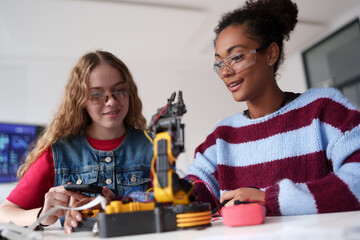 High school students working on robotics project. Girls in STEM.