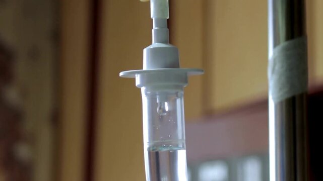 Medical Concept saline IV drip dropper at clinic emergency medicine saline hospital room sick drops therapy treatment patient chemotherapy healthcare