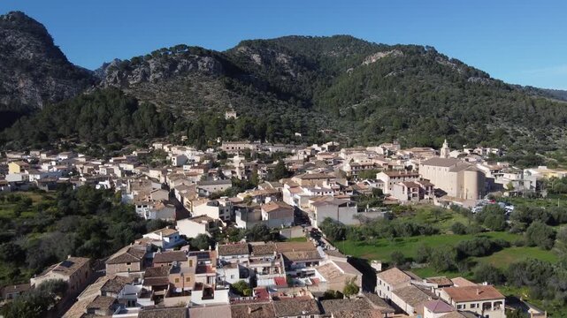Aerial overview of the village of Caimari, with the Tramuntana mountain range in the background. Mallorca, Spain.