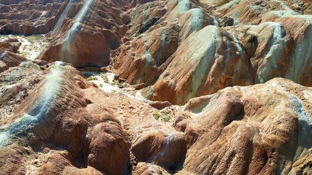 Aerial drone view of eroded sandstone ridges in Zhangye Danxia National Geopark, Gansu, China