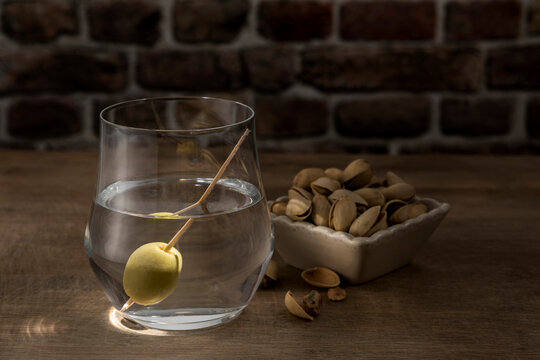 Dry Martini with green olive