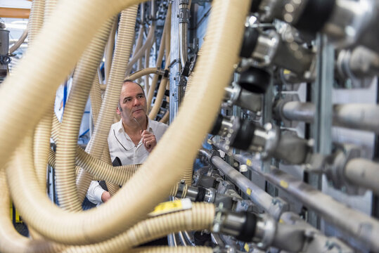 Man examining the system in factory