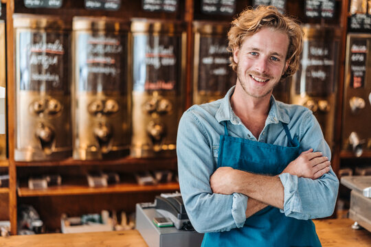 Portrait of smiling coffee roaster in his shop
