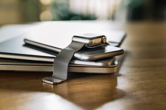 Stack of mobile devices on table top
