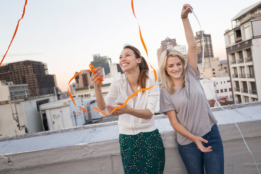 Friends having fun on a rooftop terrace