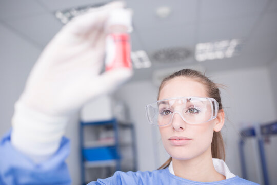 Scientist in lab examining sample