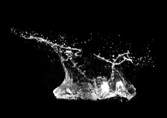Water splash in action against a dark backdrop. Capturing a moment of dynamic fluid motion.