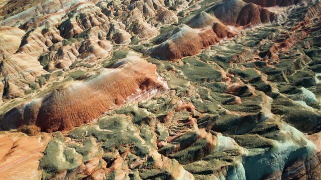 Aerial drone view of eroded sandstone ridges in Zhangye Danxia National Geopark, Gansu, China