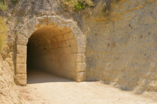 Nemea stadium ancient stone tunnel entrance. Ancient stone tunnel structure providing entrance into the historic Nemea stadium.