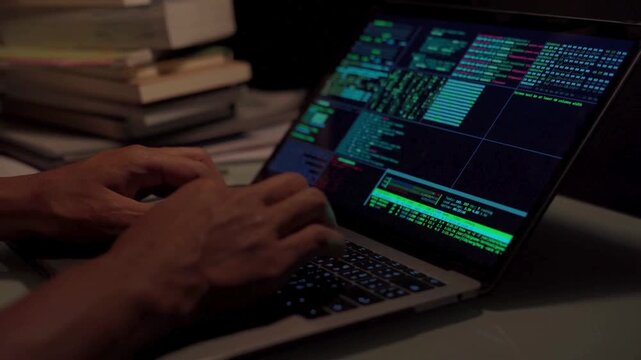 Extreme close-up human hands. Side view. Cyber security close-up Coder programmer interact with chat bot, Programmer writes code in office at Night