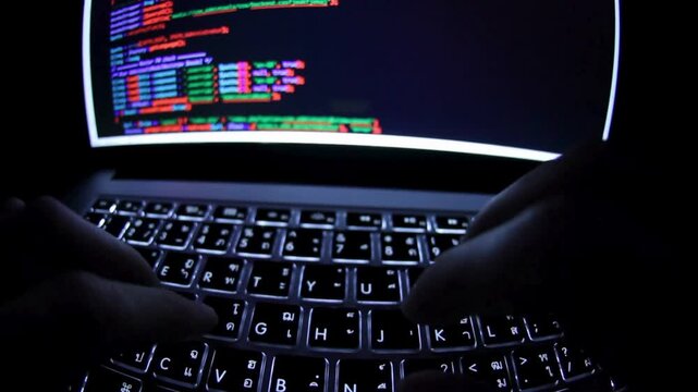 Close-up Static Shot screen, IT specialist programmer work at home typing code on laptop. hands type html code and programming on screen laptop. UHD