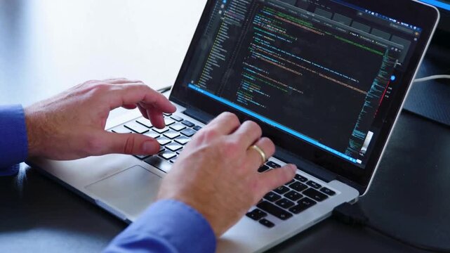 Man hands coding html and programming on screen laptop, IT engineer software developer keyboard. Programmer or coder is typing code on keyboard 4K HD