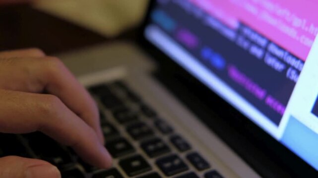 Programmer writes the code software developers working late back view Closeup coding on screen, VPN cybersecurity programmer, typing and developing IT