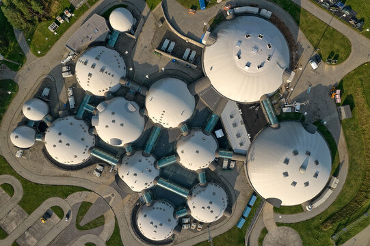 Top down aerial view of interconnected geodesic domes and glass corridors at Alvernia Studios film production complex, Nieporaz, Krakow, Poland, Europe.
