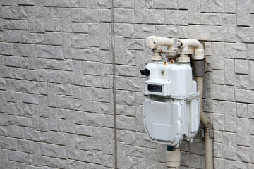 Residential gas meter installed on exterior wall