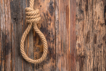 Obraz premium Thick rope on wooden background 