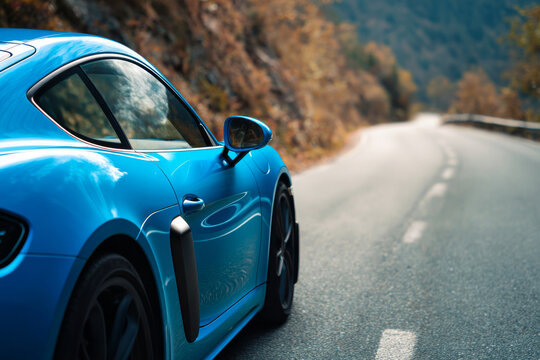 voiture sportive bleue sur route sinueuse vide, profil complet, no people, lumi&Atilde;&uml;re ensoleillee de midi, details nets et ombres naturelles, style photographie automobile premium