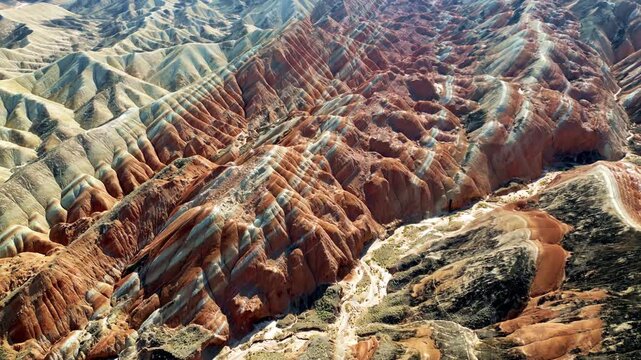 Aerial drone view of eroded sandstone ridges in Zhangye Danxia National Geopark, Gansu, China