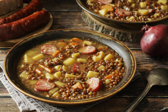 A bowl with traditional German Linsensuppe lentil soup in rustic style	