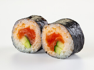 Two fresh salmon and cucumber maki sushi rolls isolated on a white background. © Andrei Starostin