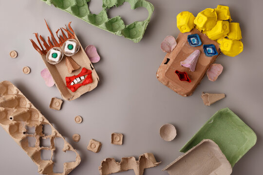 Creative kids DIY project using recycled egg cartons to make funny faces. Sustainable craft activity for preschool education, art therapy, eco friendly toy brands, and home schooling content