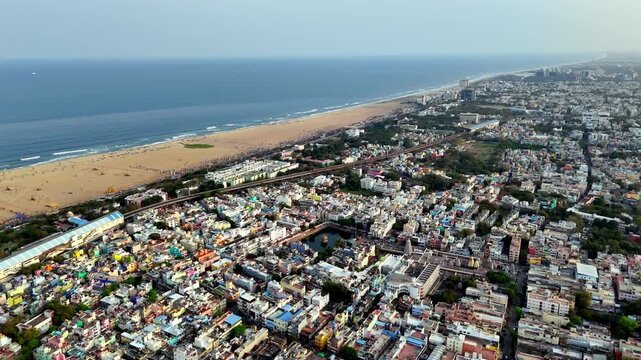 Aerial perspective of Chennai&rsquo;s Triplicane area, highlighting the sacred temple tank, bustling urban blocks, and vibrant neighborhood landscape close to the Marina coastline.