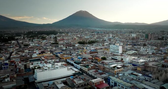 Aerial panorama of Arequipa with the El Misti volcano on the horizon, cityscape in Peru.