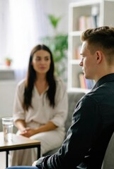 Fototapeta premium A couple is engaged in a therapy session, with the therapist or one partner speaking while the other listens attentively, emphasizing open communication and emotional support in a calming, professiona