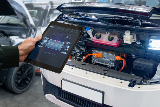 Checking the battery pack of an electric car at a service center