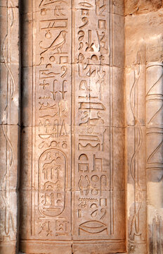 ncient Egyptian hieroglyphs on stone column, Karnak Temple Complex, Luxor, Egypt, Africa. Stone carvings with hieroglyphs at Karnak temple complex, Thebes