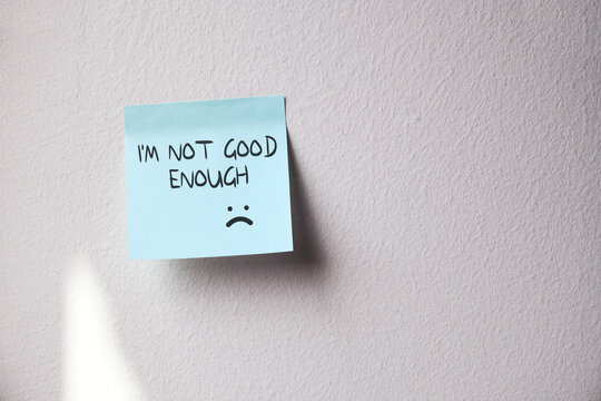 Negative sticky note expressing I'm not good enough, low self esteem concept