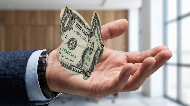 Creative hand folding dollar bill into butterfly symbolizing transformation value reinvention financial creativity economic change and imaginative business thinking