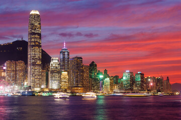 Hong Kong city skyline at sunset with glowing sky and skyscrapers