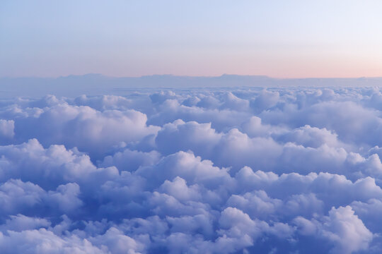 Sunset above the clouds from airplane