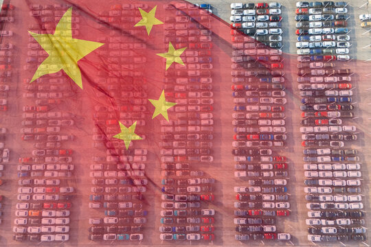 Chinese flag on a background of a lot of cars.