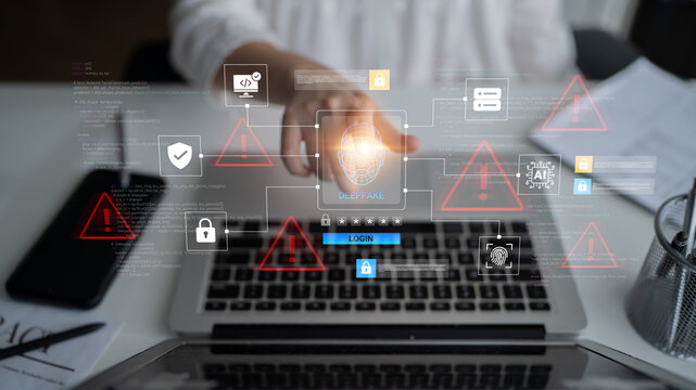 A dynamic capture of a person hand reaching for a laptop in a digital workspace, highlighting cybersecurity themes with visual alerts and protective measures in a modern context. Ledger